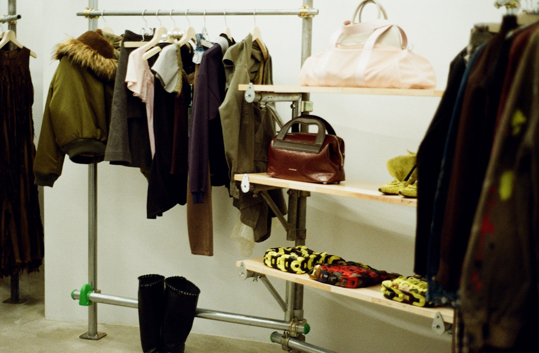Clothing and accessories displayed on a rack