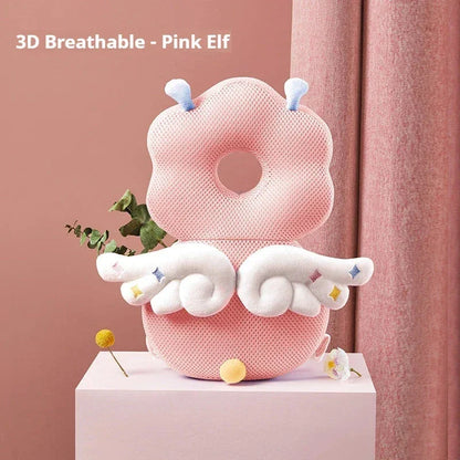 3D breathable pink elf baby pillow with white wings and antennae on pink backdrop