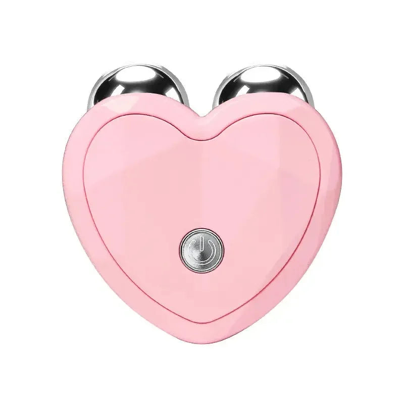 Pink heart-shaped handheld facial roller massager with two silver massage balls and power button