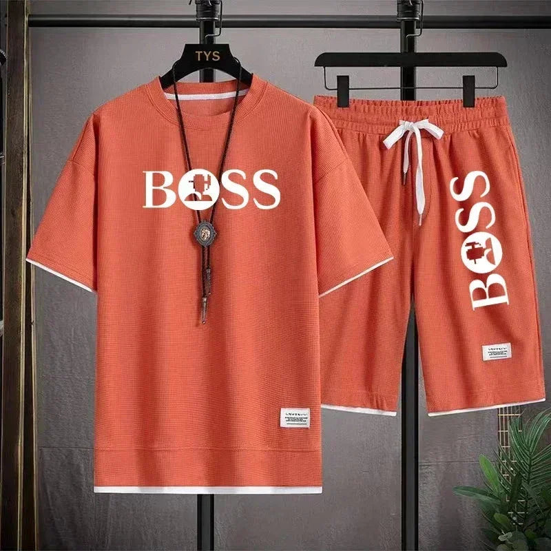 Orange casual two-piece set with white trim, featuring BOSS logo on t-shirt and shorts