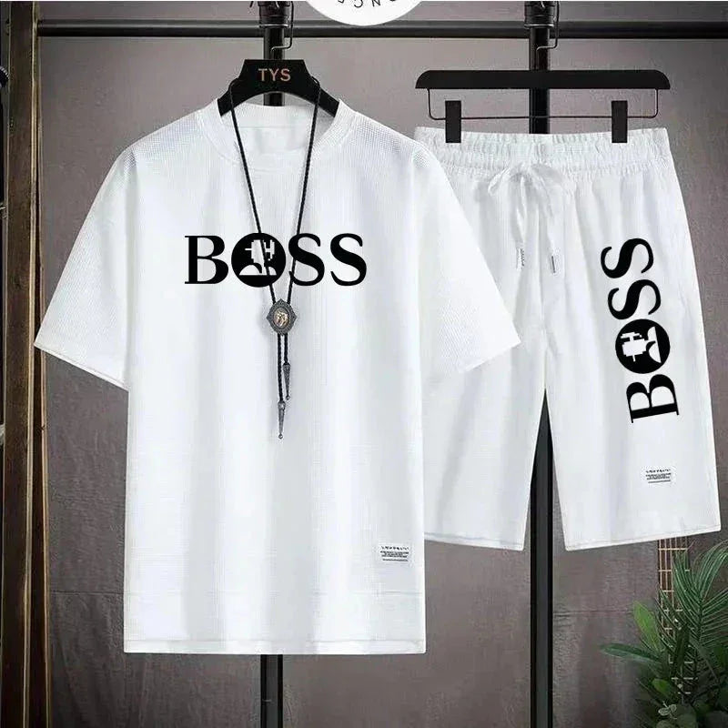 White casual two-piece outfit with BOSS logo shirt and shorts on black hangers
