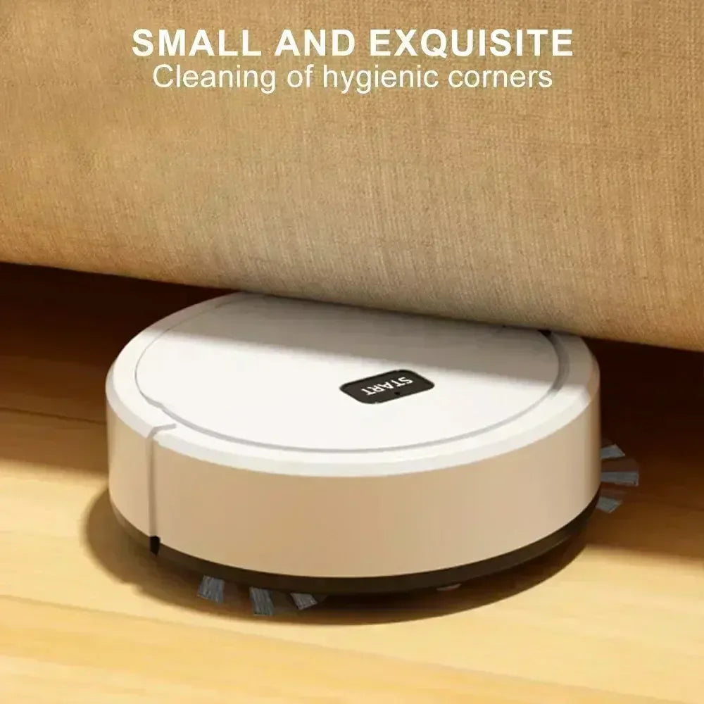 Small white robotic vacuum cleaner cleaning under a beige sofa on wooden floor