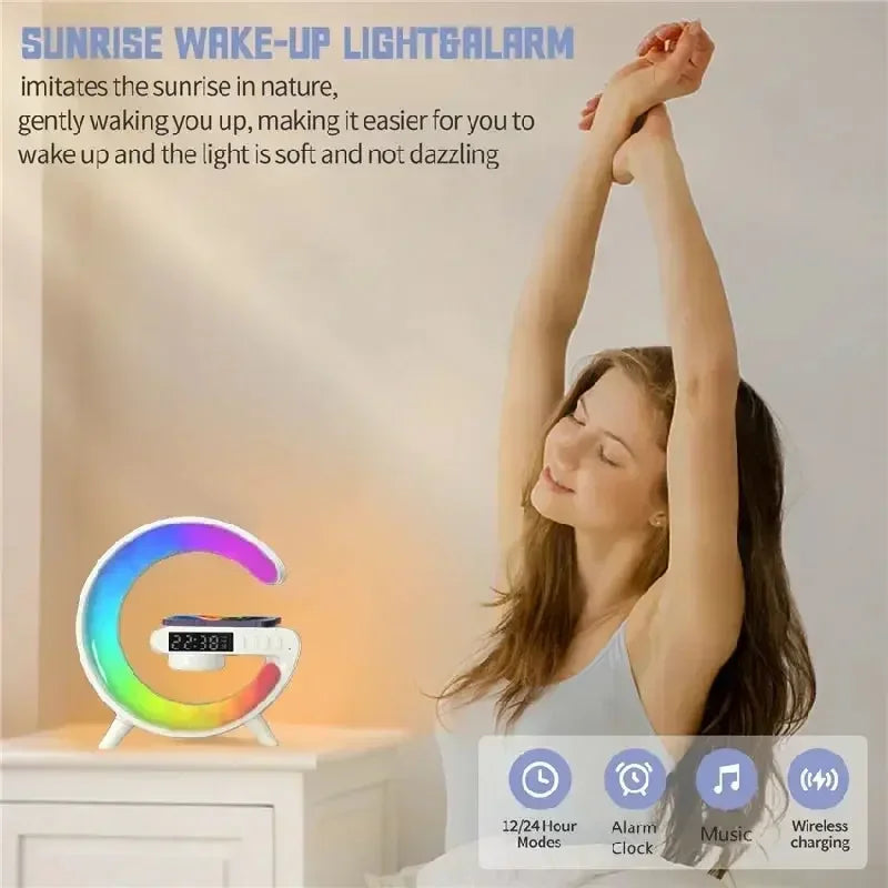 Sunrise wake-up light and alarm clock on nightstand with woman stretching in bedroom