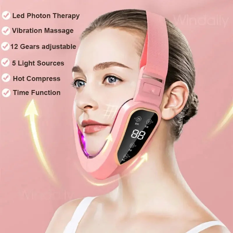 Woman wearing pink LED photon therapy face slimming mask with vibration massage and hot compress features