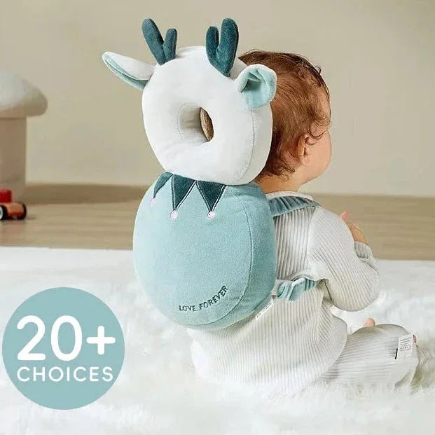 Baby wearing a blue and white antlered plush safety cushion backpack with 'LOVE FOREVER' text, sitting on a white rug