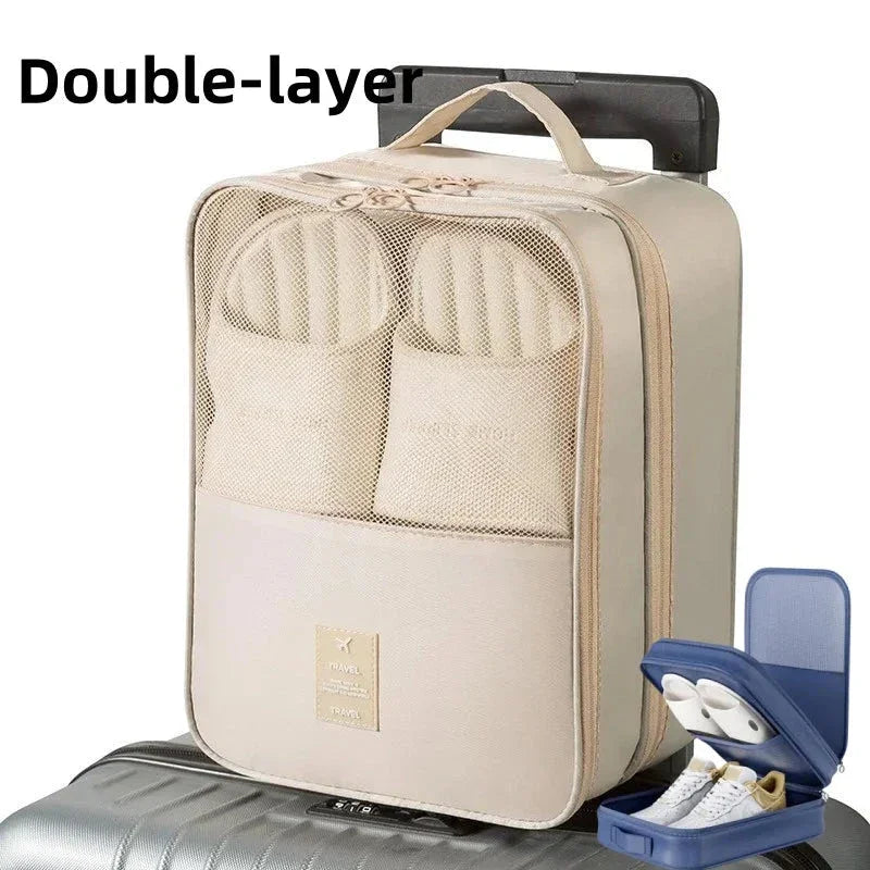 Beige double-layer travel shoe bag on luggage with mesh compartments and zip closure