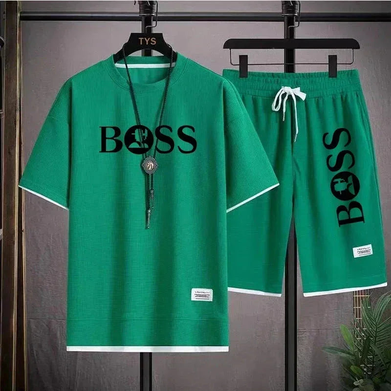 Green casual short-sleeve shirt and shorts set with black BOSS logo, white trim, and drawstring shorts