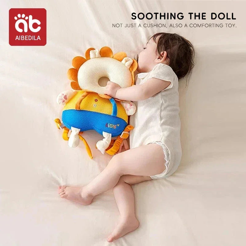 Baby sleeping while cuddling colorful lion-shaped soothing doll cushion on bed